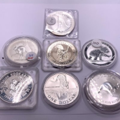 7 Australian One ounce dollars. (A)