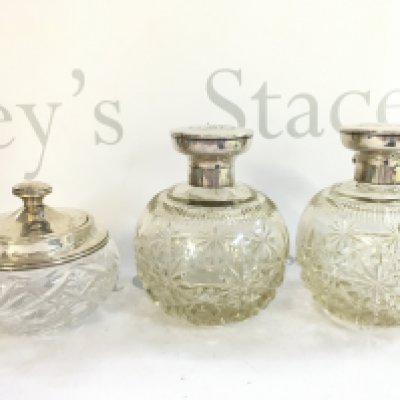Three silver hallmarked topped bottles, 13cm tall this lot cannot be posted