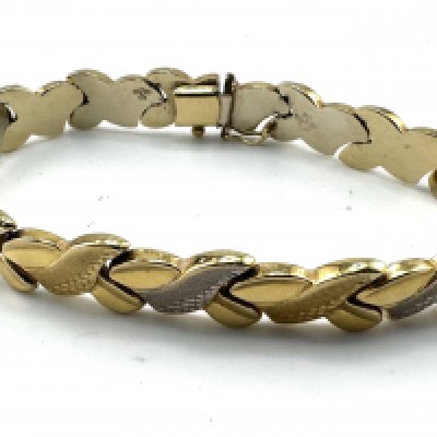 A 14ct yellow and white hollow gold bracelet. 11.87g, 20.5cm