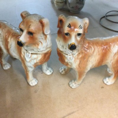 A pair of Staffordshire dogs and one other ceramic dog.