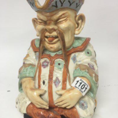 A large Victorian Majolica caricature jug in the form of a seated oriental man marks to the base W & R L 3. Height 30cm some damage see images.