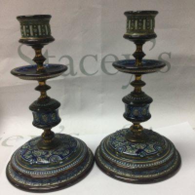 A pair of Doulton Lambeth candle sticks 2O cm