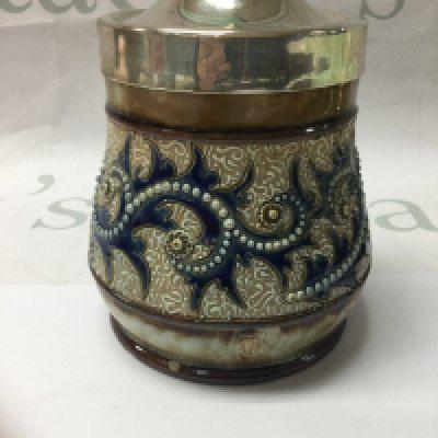 A Doulton Lambeth George tinworth preserve jar . With silver plated Lid and silver rim . 12 cm .