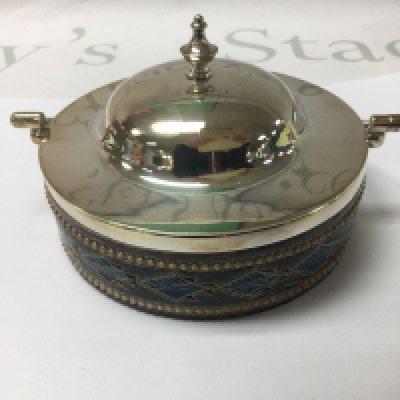 A Doulton Lambeth preserve jar with silver plated cover .