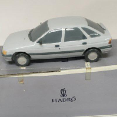 A Lladro porcelain model of a Ford Escort car. With box no damage.