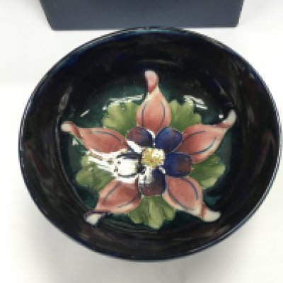 A small moorcroft dish with box. Approximately 10.5cm wide.