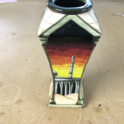 A moorcroft damascus vase designed by Beverley Wilkes 2009. 16.5cm tall and in good condition.