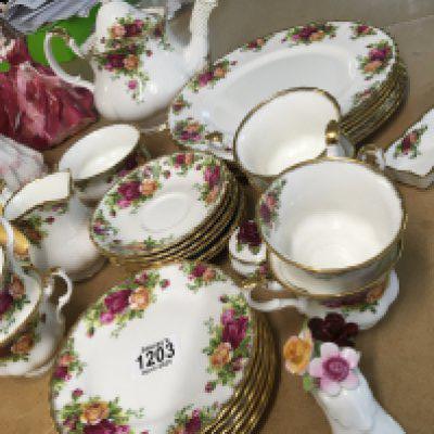 A Royal Albert Old English Country Rose pattern tea and dinner set a six place tea set with tea pot cream jug and sugar bowl cups saucers and side plates and six dinner plates and other oddments no obvious damage.