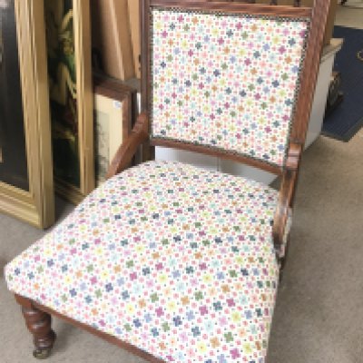 A Carved Edwardian Chair With Floral Upholstery.