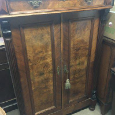 A Continental burr walnut cabinet fitted with a single drawer above cupboards. Hight 136cm x95cm