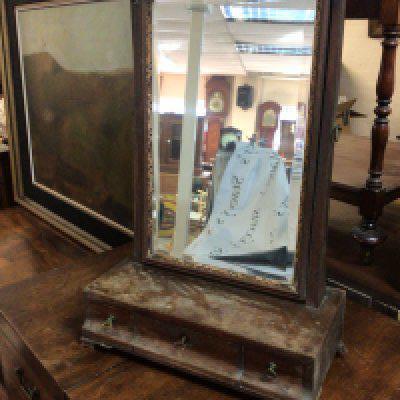 A George III mahogany dressing table mirror for restoration with a bevelled edge mirror above three drawers.