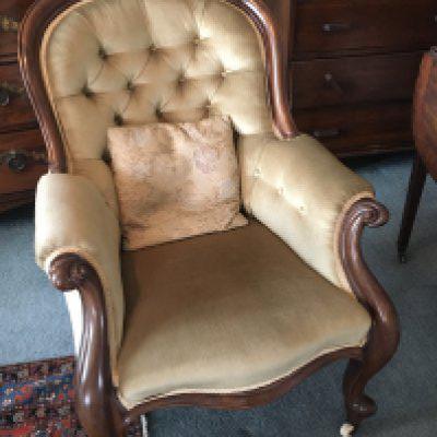 A Quality Victorian arm chair in good condition tastefully upholstered in a pale green button back fabric with scroll mahogany frame.