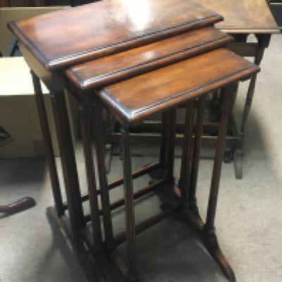 Two nests of three mahogany occasional tables (2)
