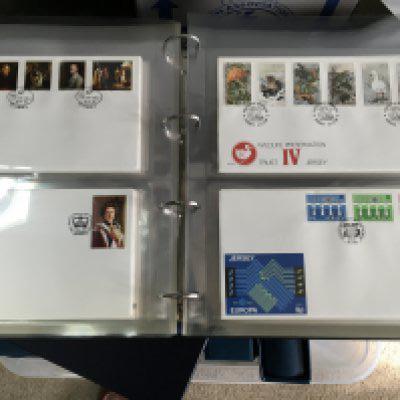 A box containing five albums of jersey first day covers.