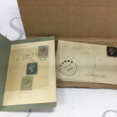 A small assortment of stamps including a penny black and a 2p blue stamp.