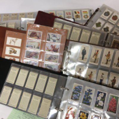 A collection of albums containing vintage cigarette cards in seven albums. (6)