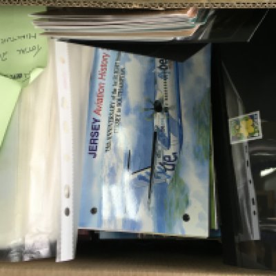 A box containing Jersey presentation packs .