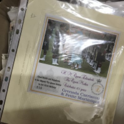 A box of GB and world stamps.