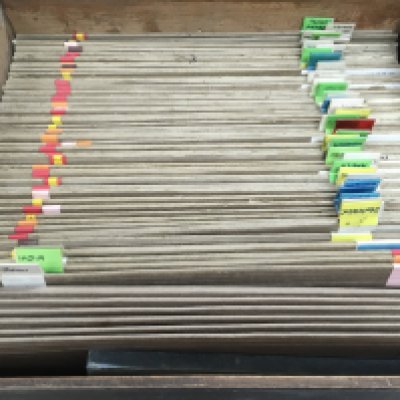 A box file of world stamps there is some water damage.