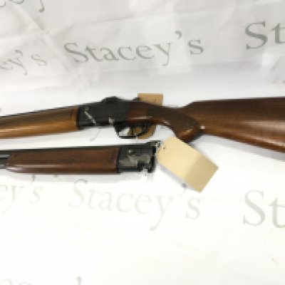 A 12bore over and under shot gun walnut stock with double trigger and ejector fixed choke R/H with a spare set of barrels maker Brno model ZH303. Serial number 317773. PLEASE NOTE THAT A SHOTGUN LICENSE IS REQUIRED TO PURCHASE THIS ITEM. VIEWING AND COLLECTING IS BY APPOINTMENT ONLY.