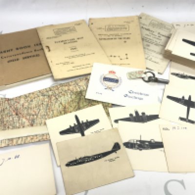 A WW2 map, Silk set of Aeroplane ID cards, other WW2 booklets and a bomb split pin. Postage category B
