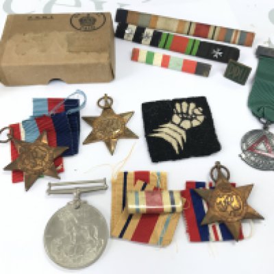 A WW2 medal group containing a Victory medal, 1939-45 star, Africa star, Italy star. Also including a 6th Armoured Brigade Cloth Formation Sign Patch Badge, 1960 Masonic safe driving medal. Postage category B
