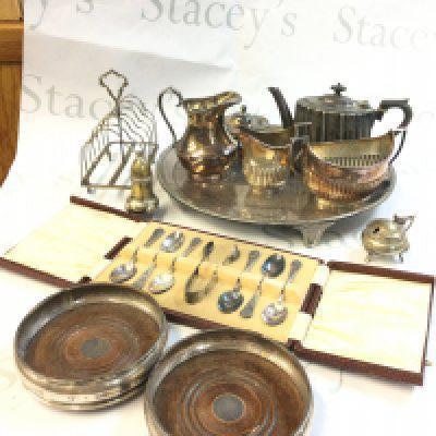 A collection of silver plated items including a dish, spoons, silver hallmarked coasters. Postage category C