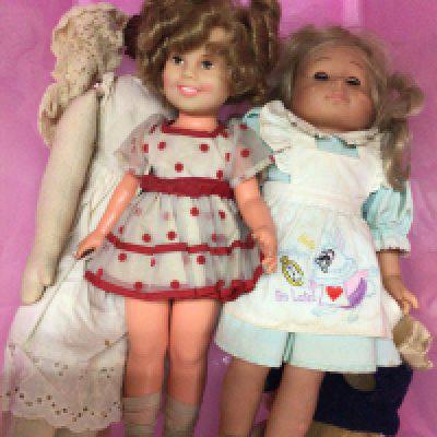 A collection of mid 20th century dolls including an Ideal Shirley Temple doll a small teddy bear and others. NO RESERVE