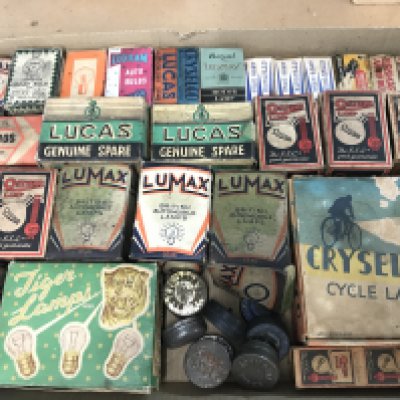 A collection of vintage light bulbs in original boxes