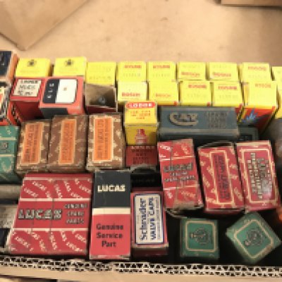 A box of vintage motoring accessories including spark plugs, bulbs etc . All boxed . This lot cannot be posted