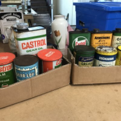 A Collection of vintage motoring grease tins including Duckhams , Shell, Castrol etc. postage category B