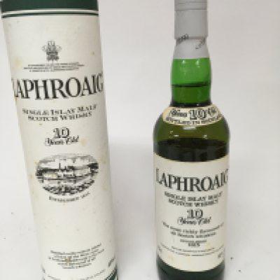 A bottle of pre Royal Warrant Single Malt Laphroaig Whiskey 10 year old and one other bottle of Laphroaig 10year Single malt in a presentation tube with Royal Warrant for the Prince of Wales both bottles 70cl (2)