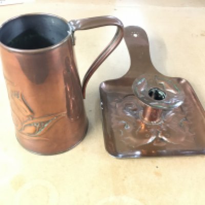 Newlyn school copper chamberstick c1910 marked on base and Art Nouveau copper jug by J Shanky marked J S and S o base 14cm tall.