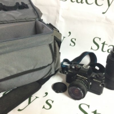 A Praktica BC1 camera and a Prakticar AF 55-200 mc lens , postage category b