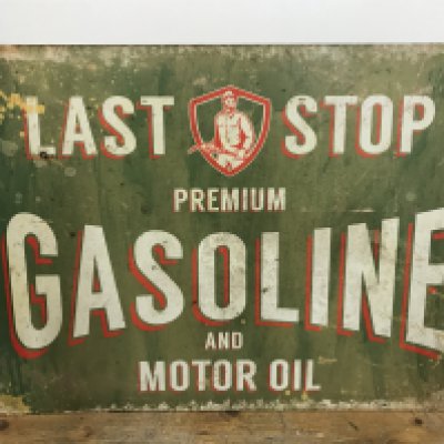 A vintage Last Stop Premium gasoline and motor oil enamel sign , 70cm wide 50cm tall
