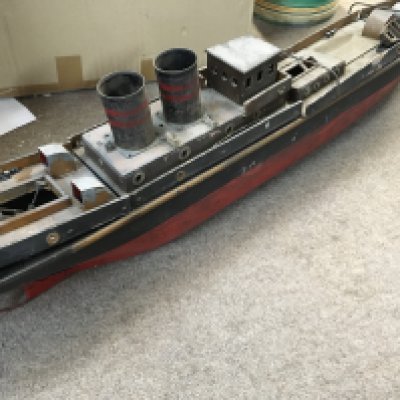 A Scratch built twin funnel boat with burner .