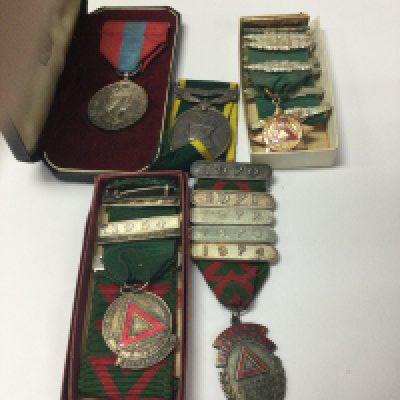 A collection of bus medals and a imperial medal.