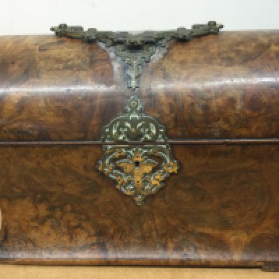 A Victorian walnut stationary box the hinged lid enclosing a fitted interior.