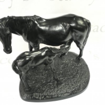 A 20th cast iron Russian model of a mare and foal. 38cm wide 28cm tall.