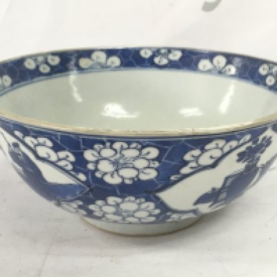 A 19th century Chinese blue and white bowl with a four character mark at the base, 18cm wide. Hairline crack seen and damage. This lot cannot be posted NO RESERVE