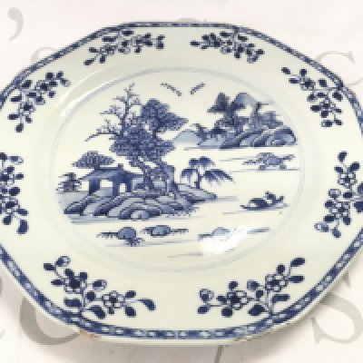 An 18th century Chinese octagonal blue and white plate decorated with a river scene , 23cm wide. Chips seen on plate. This lot cannot be posted NO RESERVE