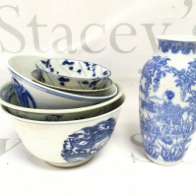 A collection of Chinese blue and white tea bowls , larger bowls and a vase . This lot cannot be posted