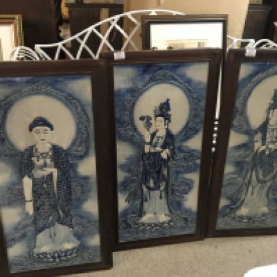 Three large early 20th century Oriental ceramic blue and white wall plaques each depicting a goddess in hardwood frames 89x46 cm (3)