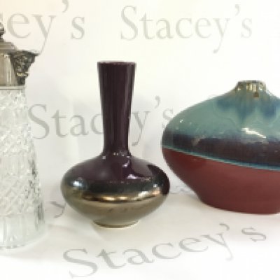 A collection of vases including art vases and a Falstaff cut glass vase with a silver plated top. This lot cannot be posted