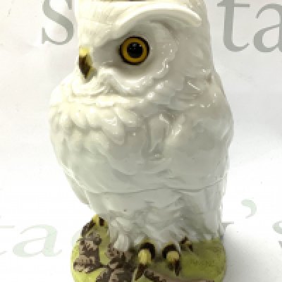 A William Whitley ceramic oil lamp with glass eyes. 18.5cm. (Top section missing).