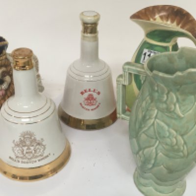 Two Art Deco hand painted jugs two full bottles of Bells Whisky and a box containing vintage commemorative Royal Memorabilia ceramics and conforming oddments.
