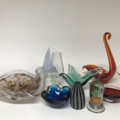 A collection of coloured and cut glass.