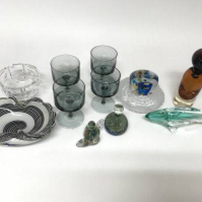 A collection of coloured and cut glass including some paperweights.