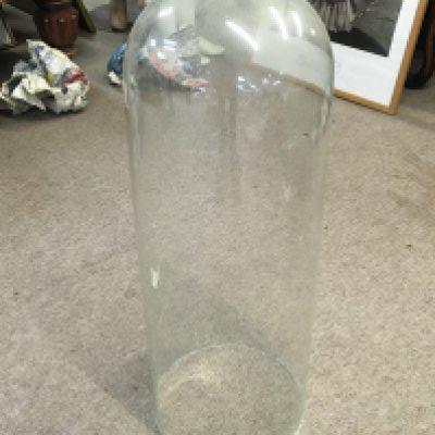 A tall glass dome 58cm tall approximately