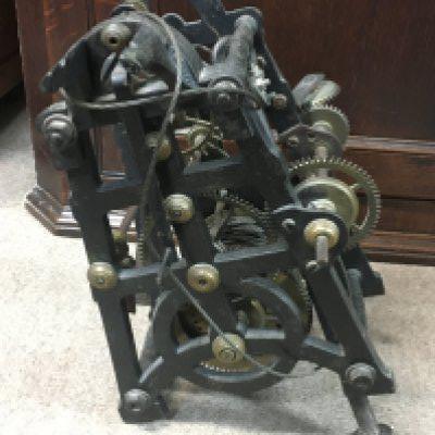 A vintage clock mechanism. This lot cannot be posted